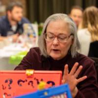 person gesturing with four fingers